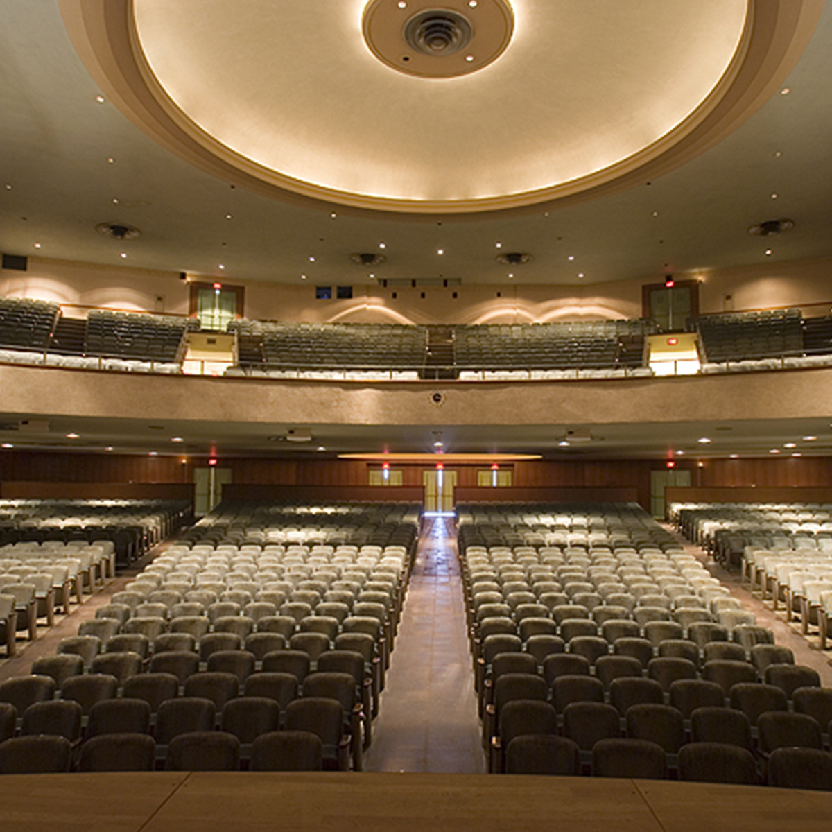 a large auditorium with rows of empty seats.