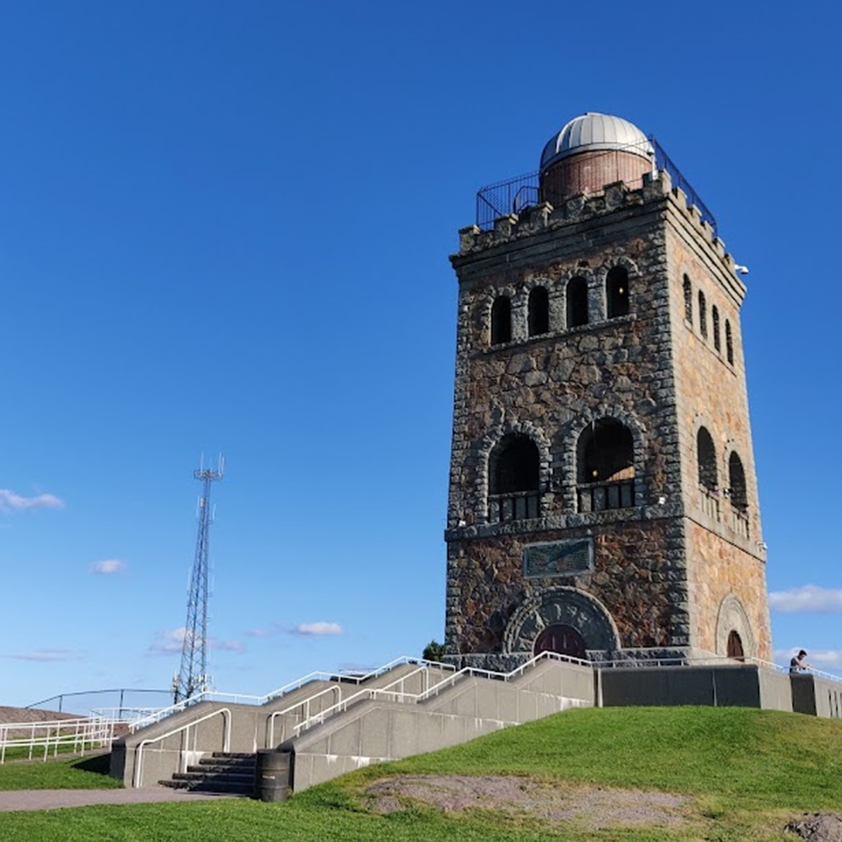 a tall tower with a dome on top of it.