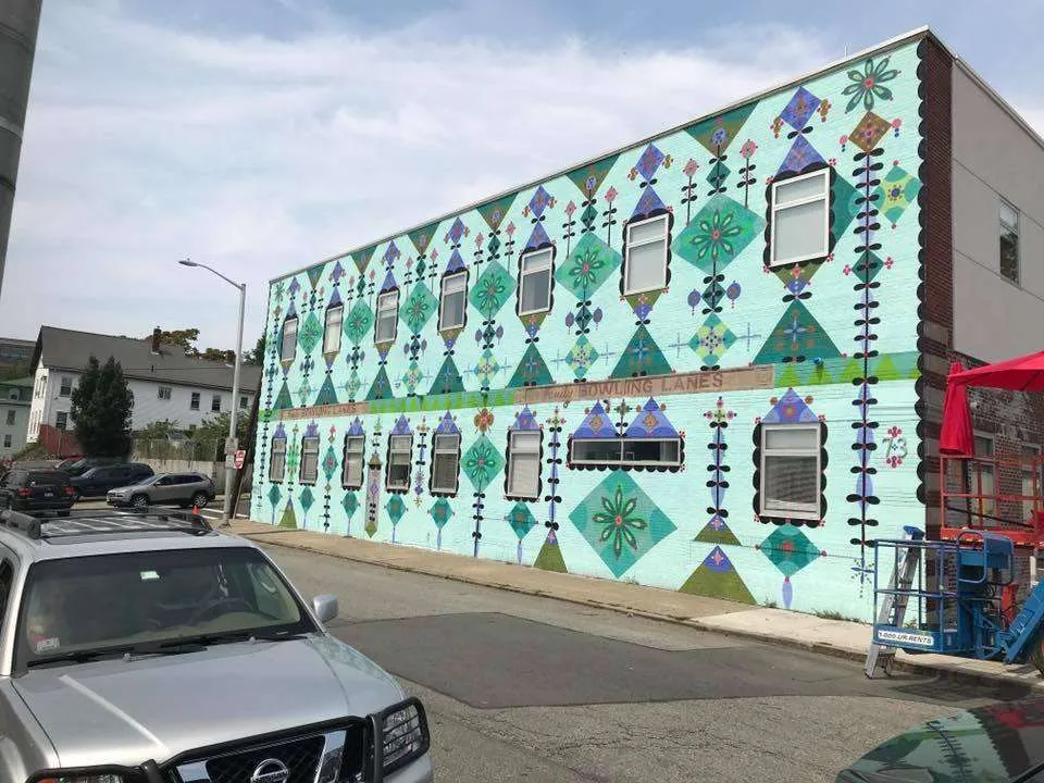 a building with a colorful mural on the side of it.