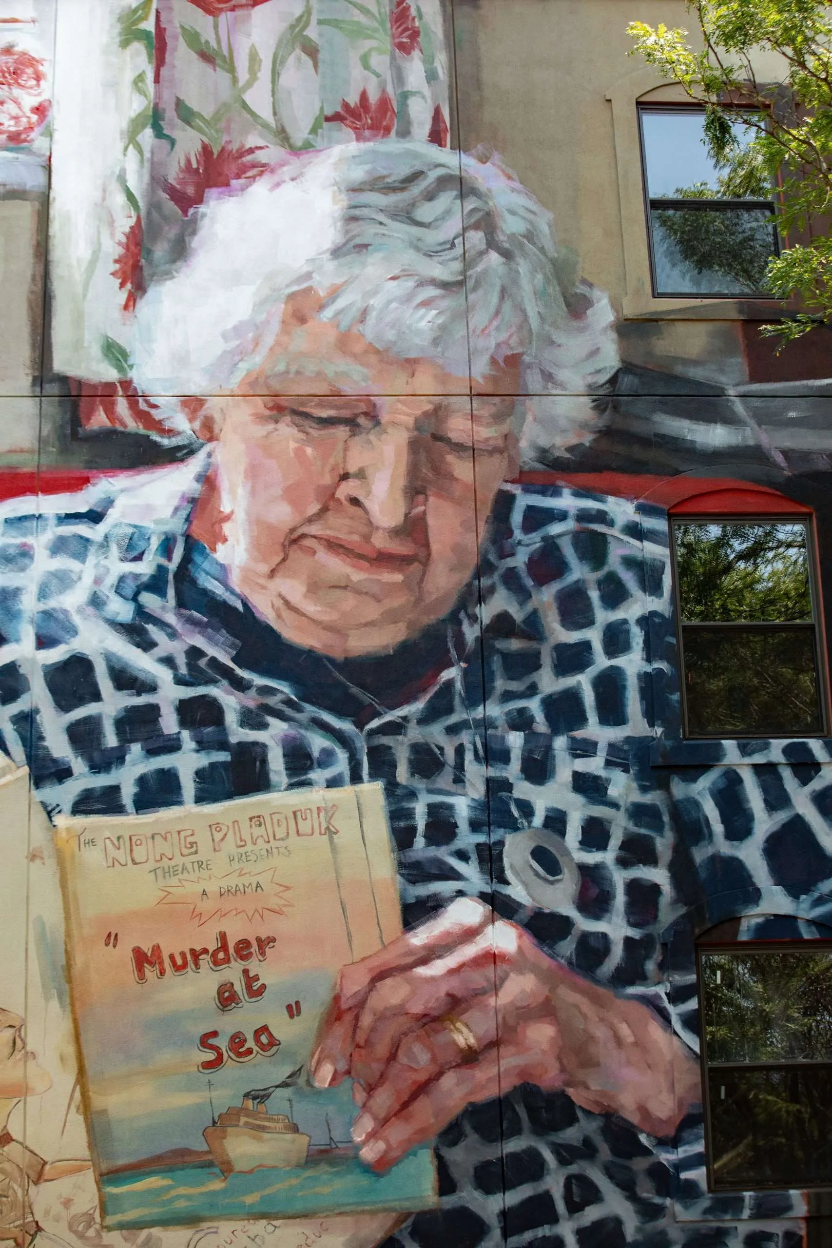 a painting of an elderly woman reading a book.