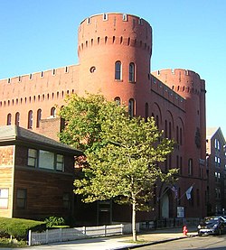 a large brick building with a tower on top of it.