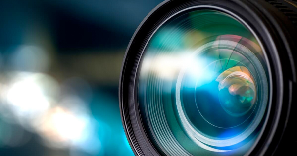 a close up of a camera lens with a blurry background.