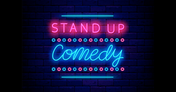 a neon sign that says stand up comedy.