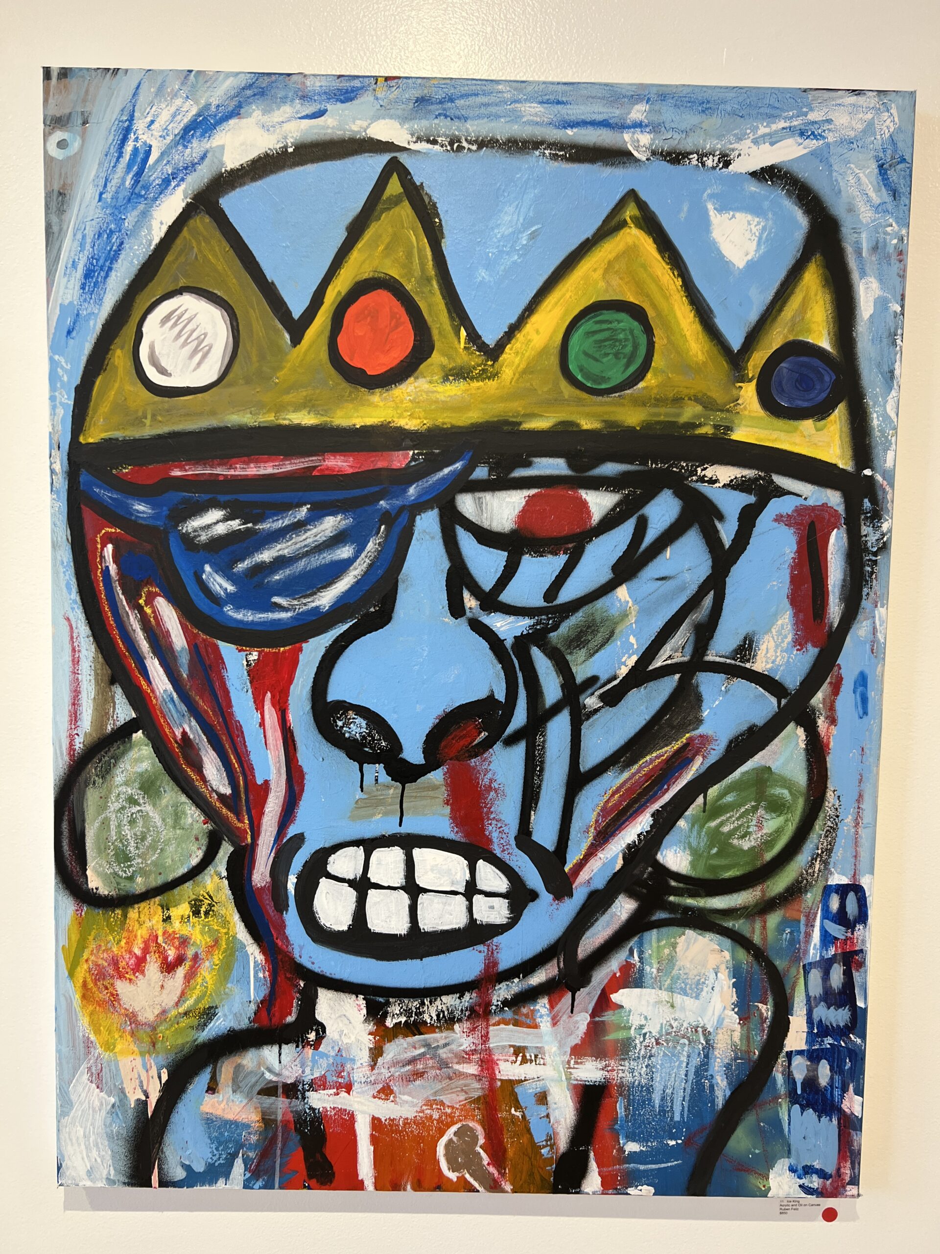 a painting of a clown wearing a crown.