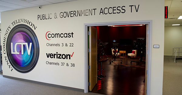 a room with a sign that says public and government access tv.
