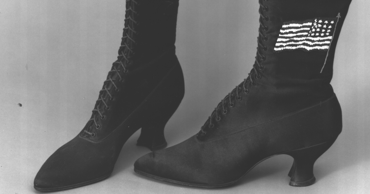a black and white photo of a pair of boots.
