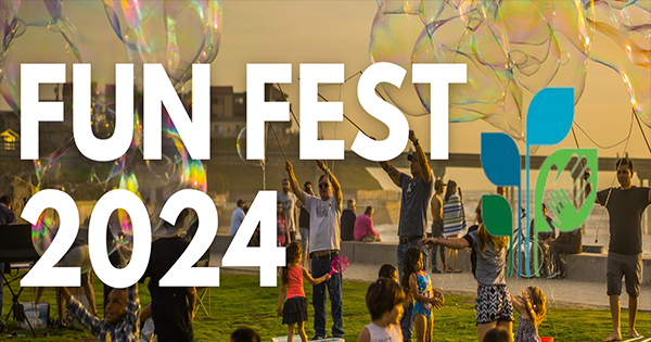 A lively crowd enjoys an outdoor festival with oversized bubbles floating in the air. The text "Fun Fest 2024" stands out boldly, capturing the excitement.