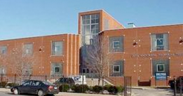 Discover our charming two-story brick building, featuring expansive windows that invite natural light into the space. The welcoming main entrance is easily accessible, with convenient parking right out front. Lush trees and well-maintained shrubs line the sidewalk, creating a picturesque setting for your visit.