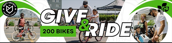 Banner showing adults and children with bicycles outdoors under tents, with text reading “GIVE & RIDE 200 BIKES” and a logo in the top left corner that says “BIKE SOCIETY.”.