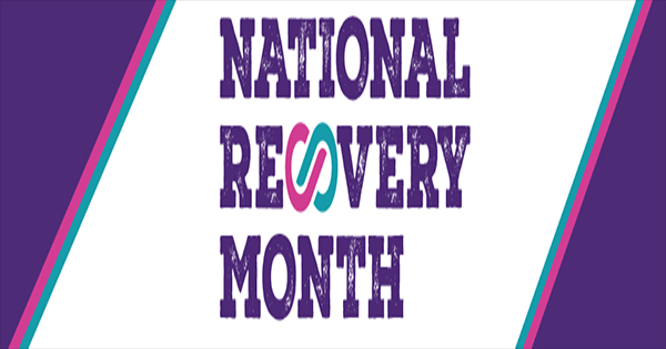 A graphic with the words “National Recovery Month” in bold purple letters on a white background, bordered by purple and teal diagonal stripes. An interlocking teal and pink design appears between “Recovery” and “Month.”.
