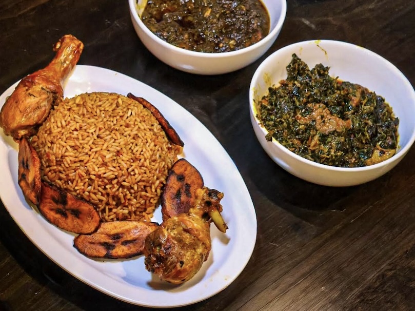 A plate of jollof rice with fried plantains at Kokomma in Downtown Lynn MA