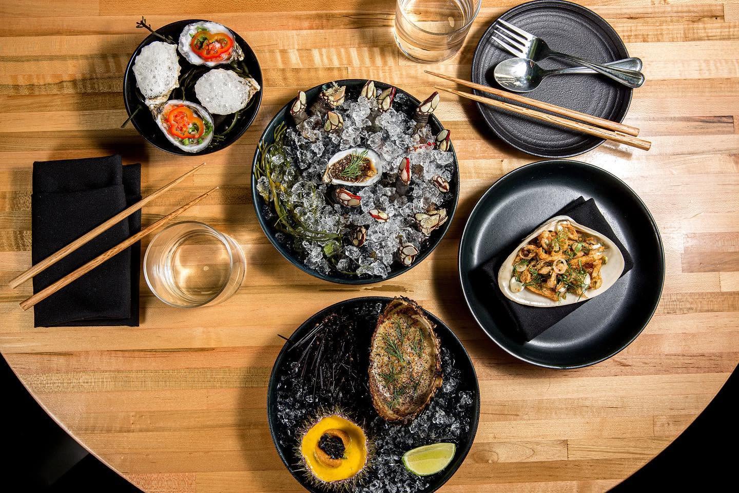 Fresh oysters and French-Vietnamese seafood dishes served on crushed ice at Nightshade Noodle Bar in Downtown Lynn MA